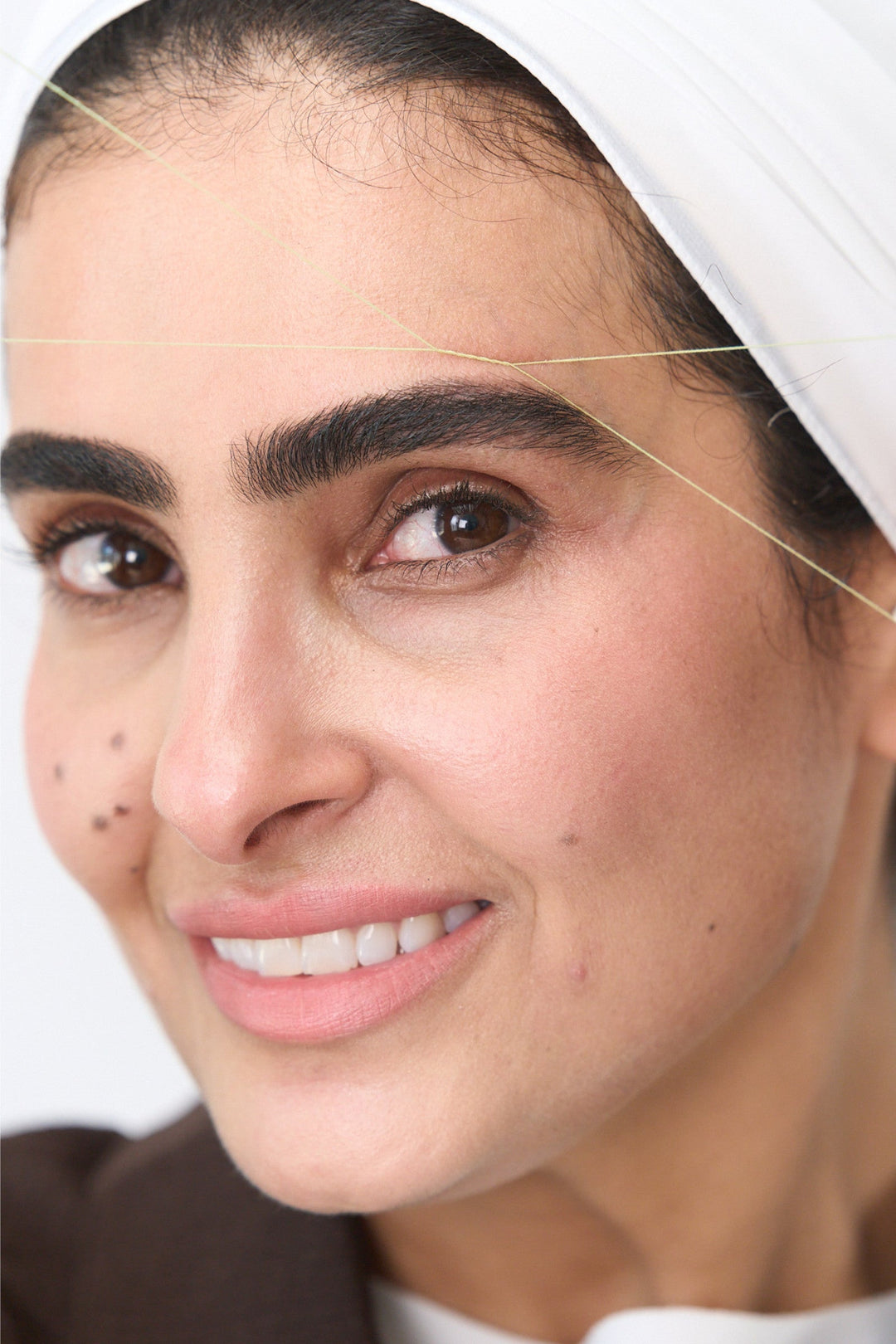 Woman getting her eyebrows threaded